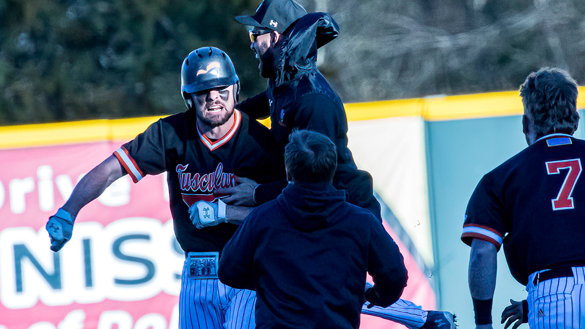Murphy Flood celebrates the first of his two walk-off hits in Tusculum's sweep over Coker (photo by Chuck Williams)
