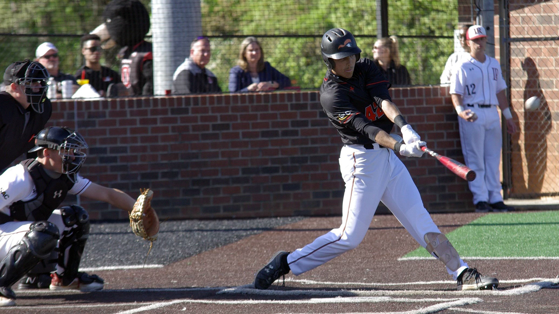 Christian Ortega hits this 3-run homer in the ninth in today's game at Lenoir-Rhyne (photo by Chris Lenker)