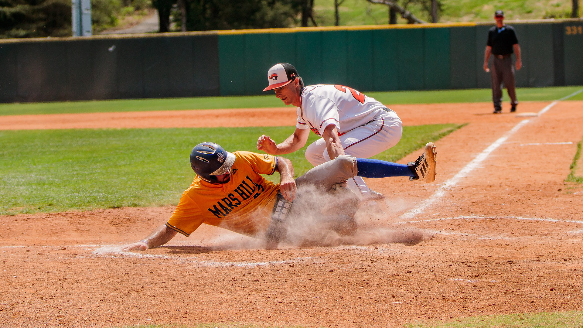 Will Webb applies the tag at home in Saturday's game with Mars Hill (photo by Kari Ham)