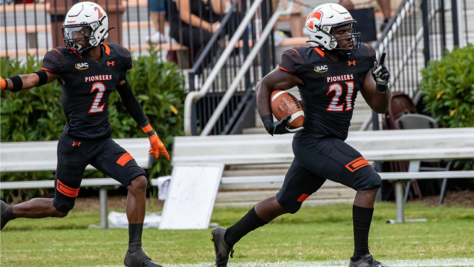 Jahaud Russ (21) is escorted to the end zone by Jermaine Witherspoon in TU's 24-21 win over Limestone (photo by Chuck Williams)