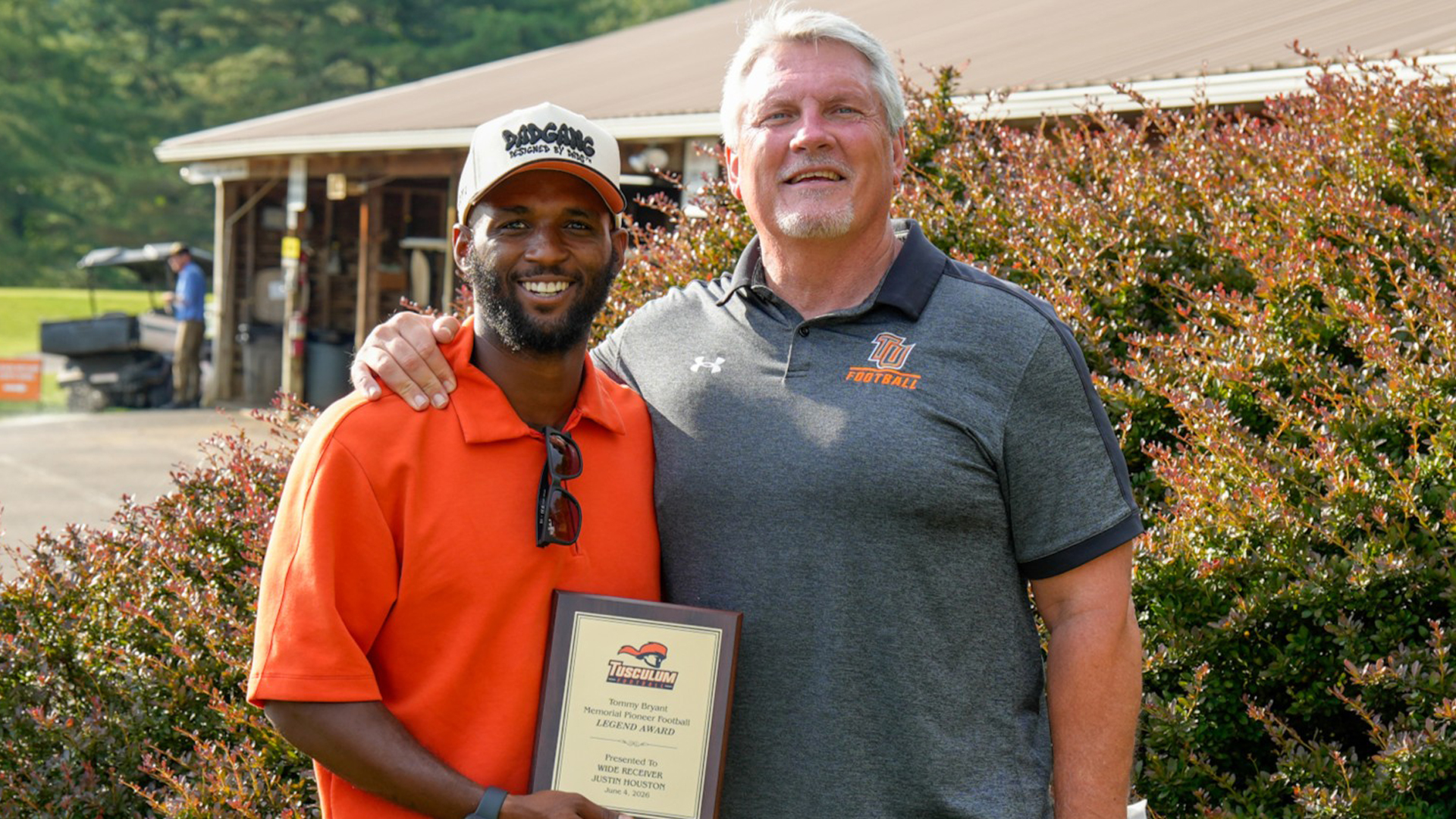 Justin Houston (Tom Bryant Legend Award recipient) with Tusculum head football coach Billy Taylor (photo by Joe Yates)