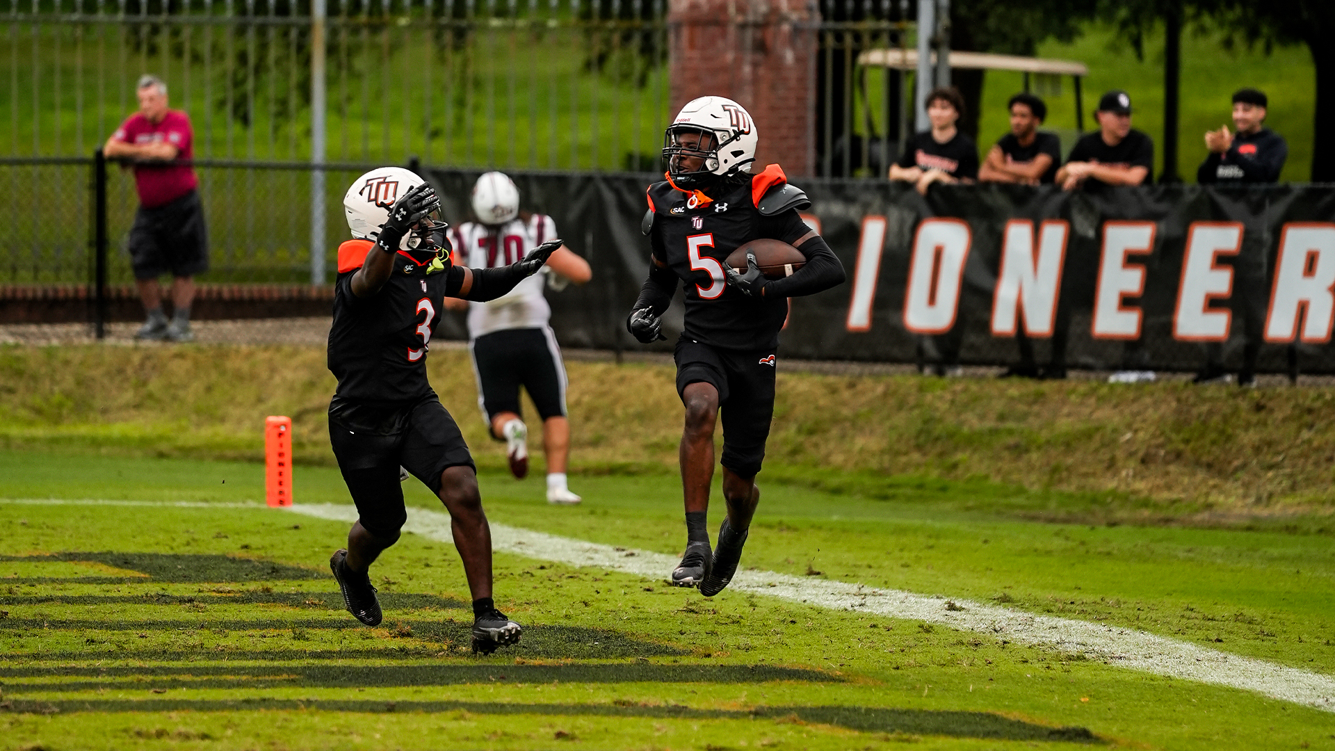 Xavier Gunn scores on his interception return in TU's home-opener with Lenoir-Rhyne (photo by Joe Yates)