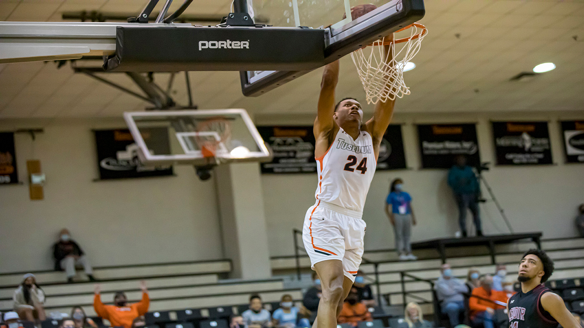 Senior Brandon Mitchell scored 13 points in his regular-season finale at Pioneer Arena. He posted three dunks on the night, including this one (photo by Chuck Williams)