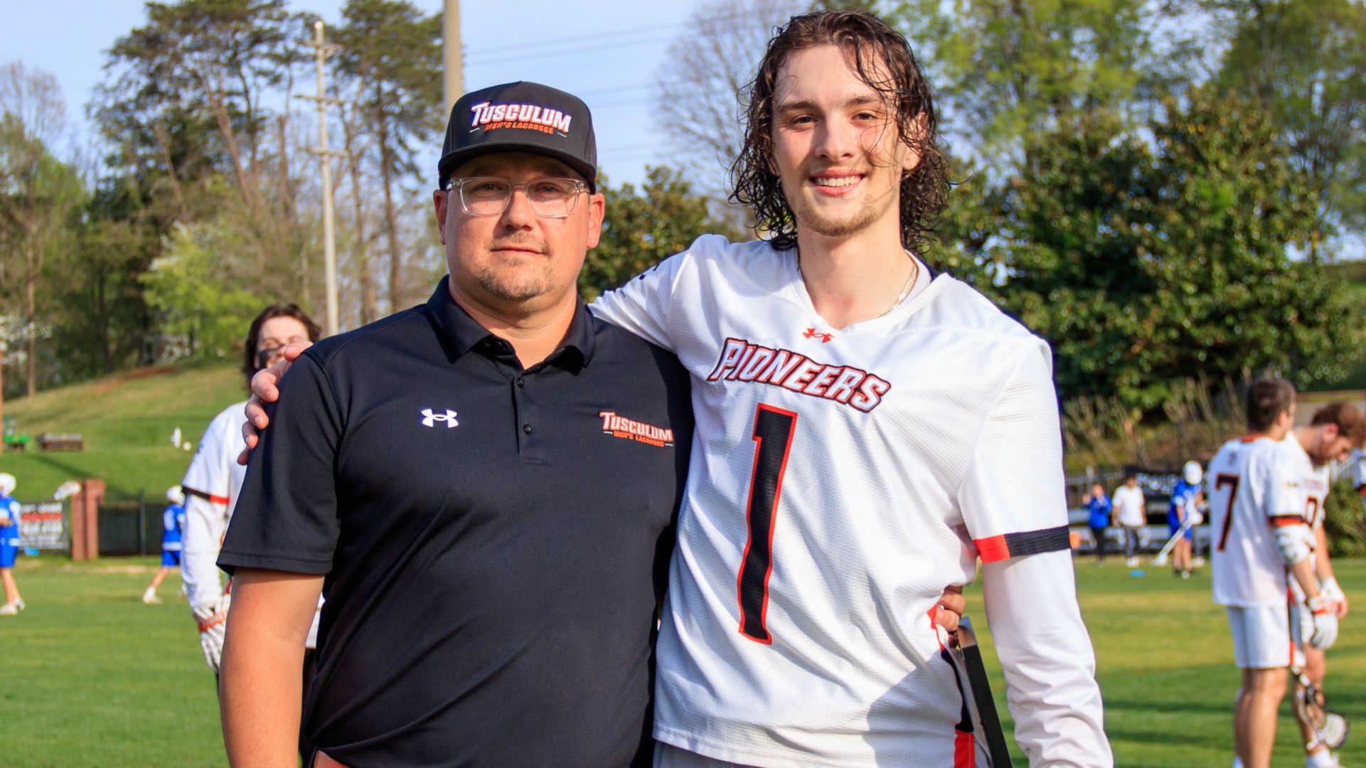 Senior Alex Germain (right) with head coach Mike Brisbin prior to Wednesday's game (photo by Kari Ham)