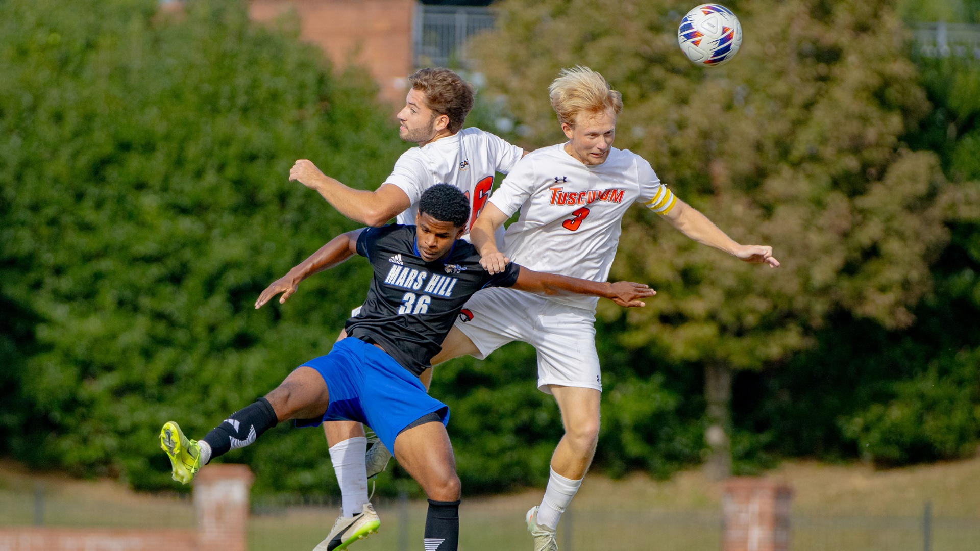 Linus Salomonsen and Gustavo Figueira Oliveira go in the air against Mars Hill (photo by Kari Ham)