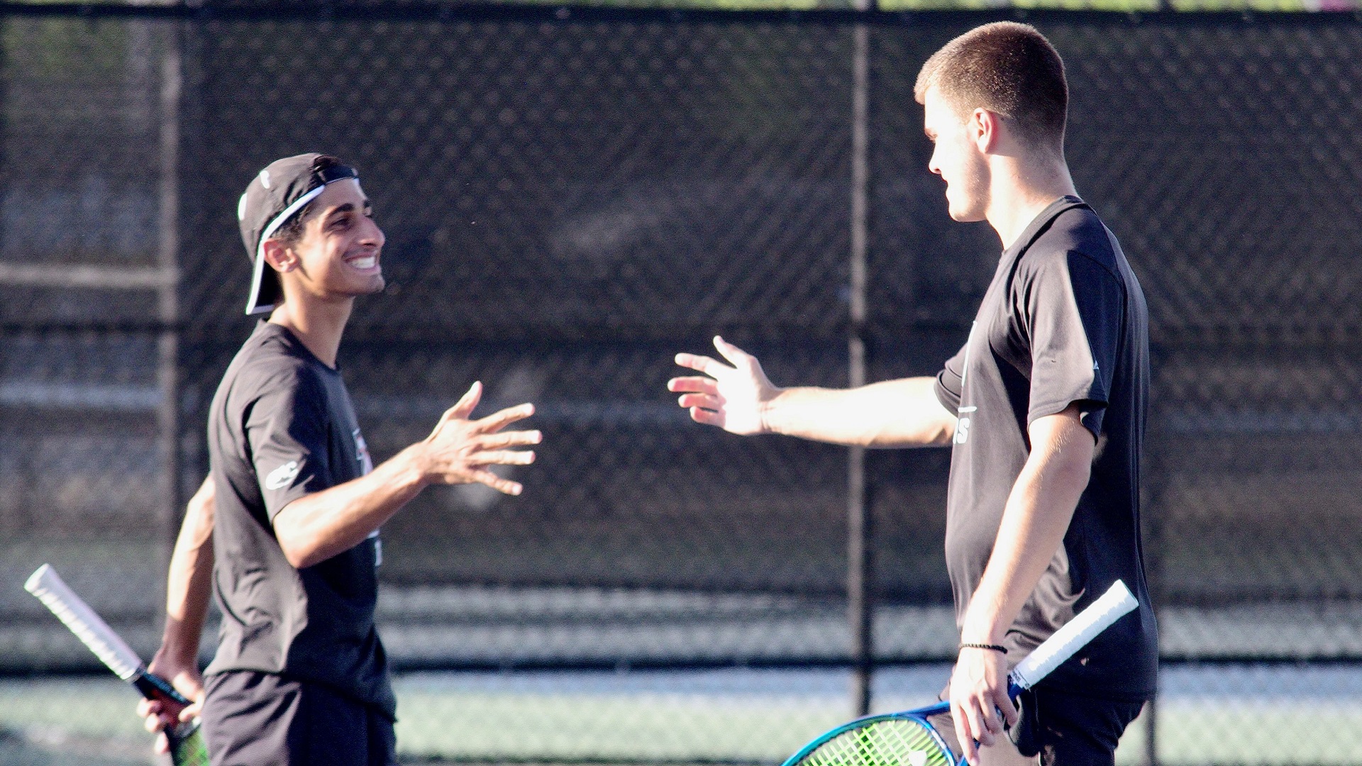 Marco Jalalian and Nemanja Subanovic celebrate their comeback win at number one doubles against Wingate (photo by Chris Lenker)