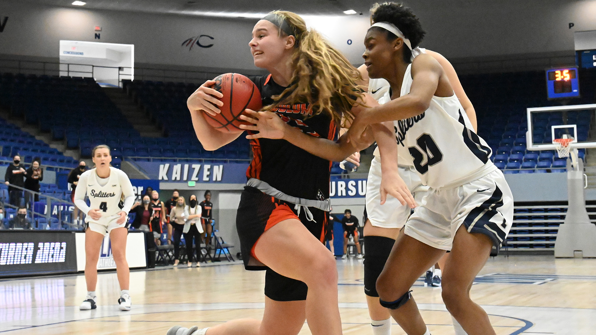 Maddie Sutton grabs her 13th rebound of the game in the final seconds to help the Pioneers clinch the win (photo by Raymond Welch/provided by LMU Athletic Communications)