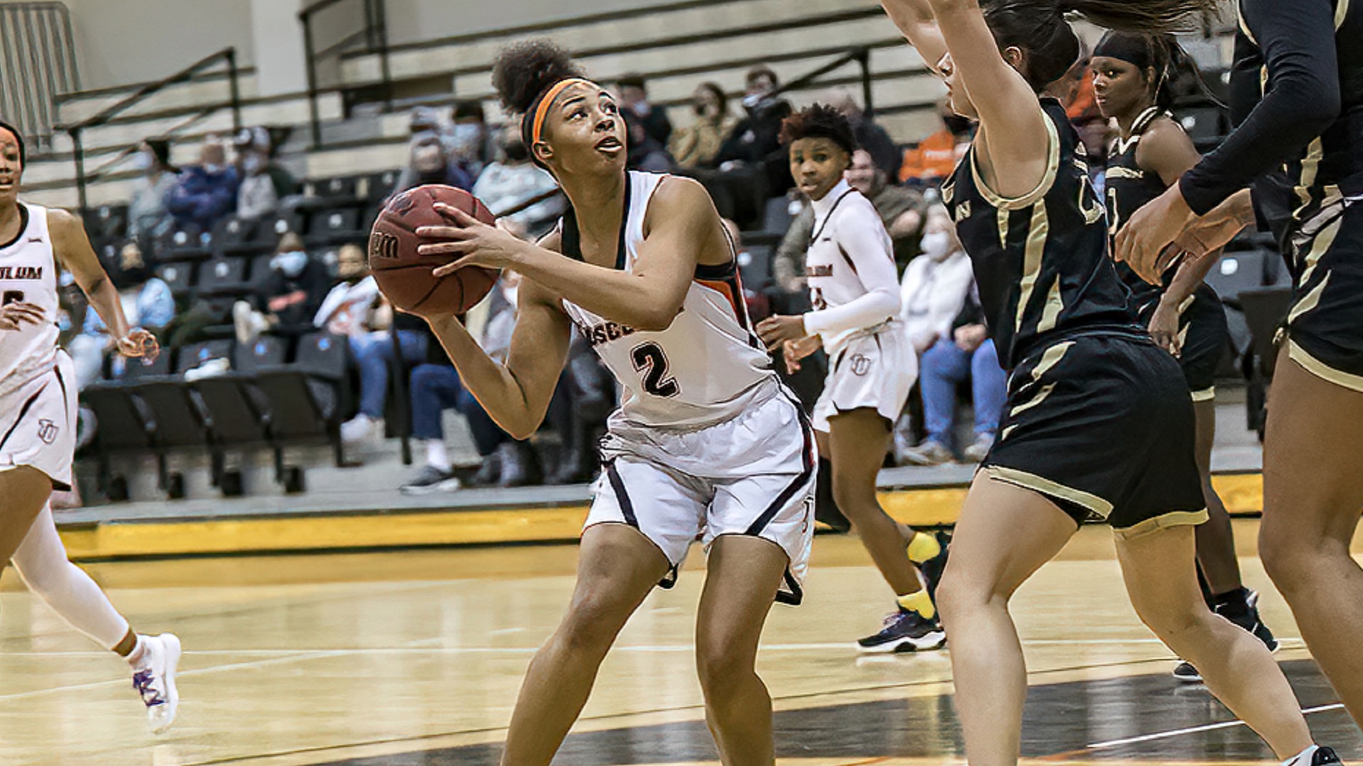 Jalia Arnwine goes up for the shot that will make her the 20th player in program history to score 1,000 points (photo by Chuck Williams)