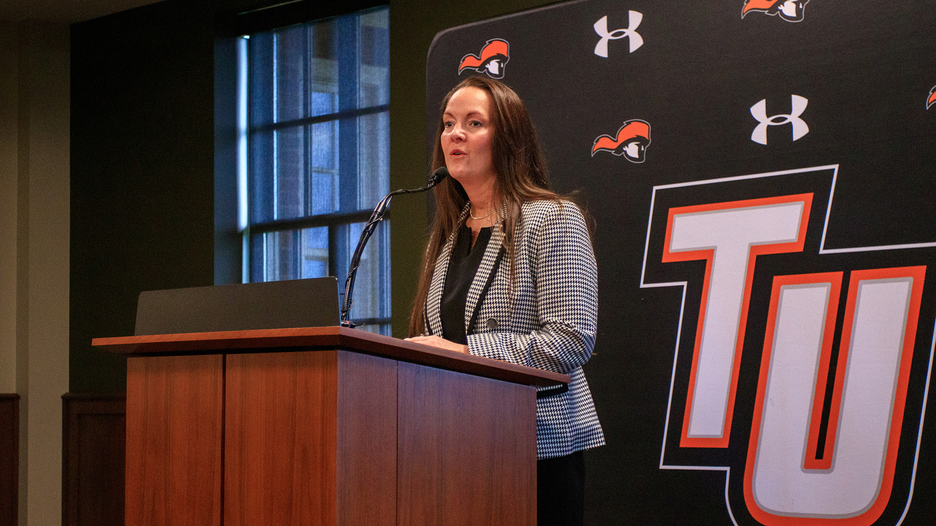 Tusculum women's basketball coach Tandy Bradford speaks with the media at Tuesday's introductory press conference (photo by Kari Ham).