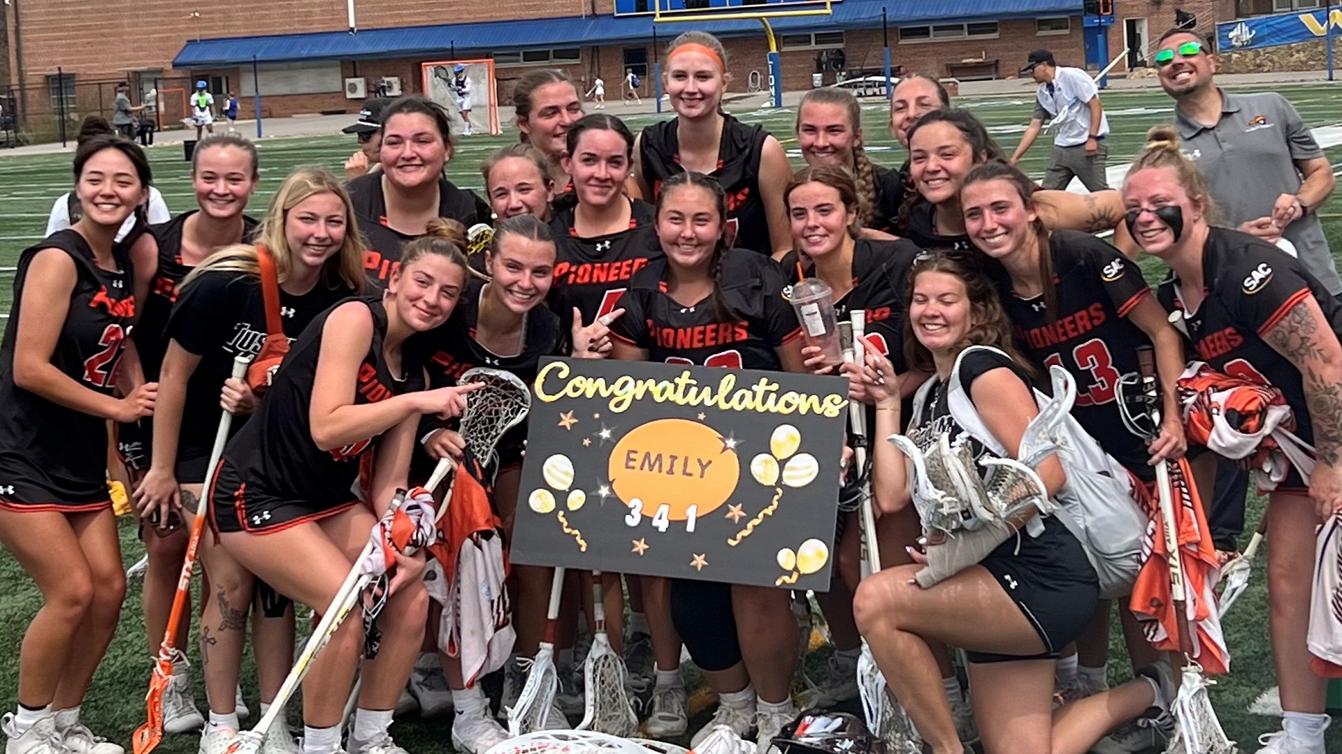 Emily White celebrates with her teammates after setting the Tusculum program career record with 341 saves (photo by Bill White)